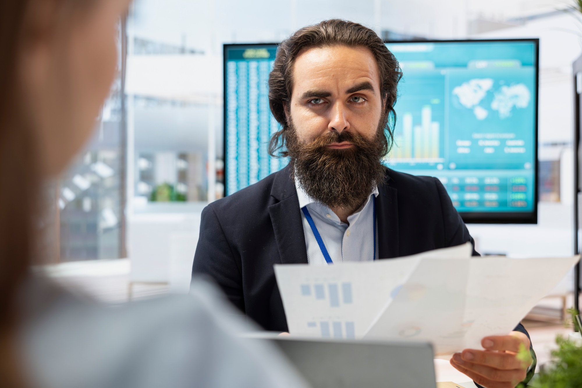 Agent talking with family, offering advice on investing and stock market trading