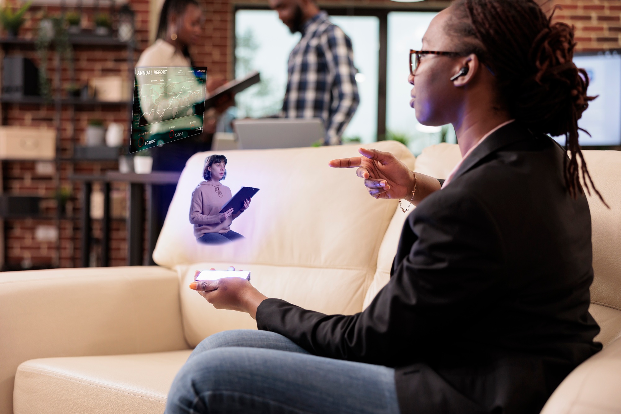 Startup worker talking to ai hologram