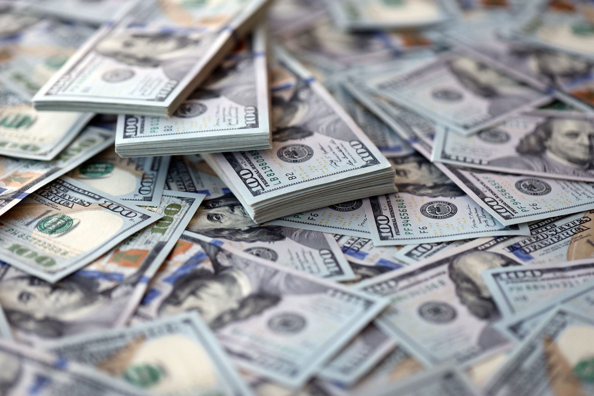 Very big amount of US hundred dollar bills. Huge quantity of united states currency notes